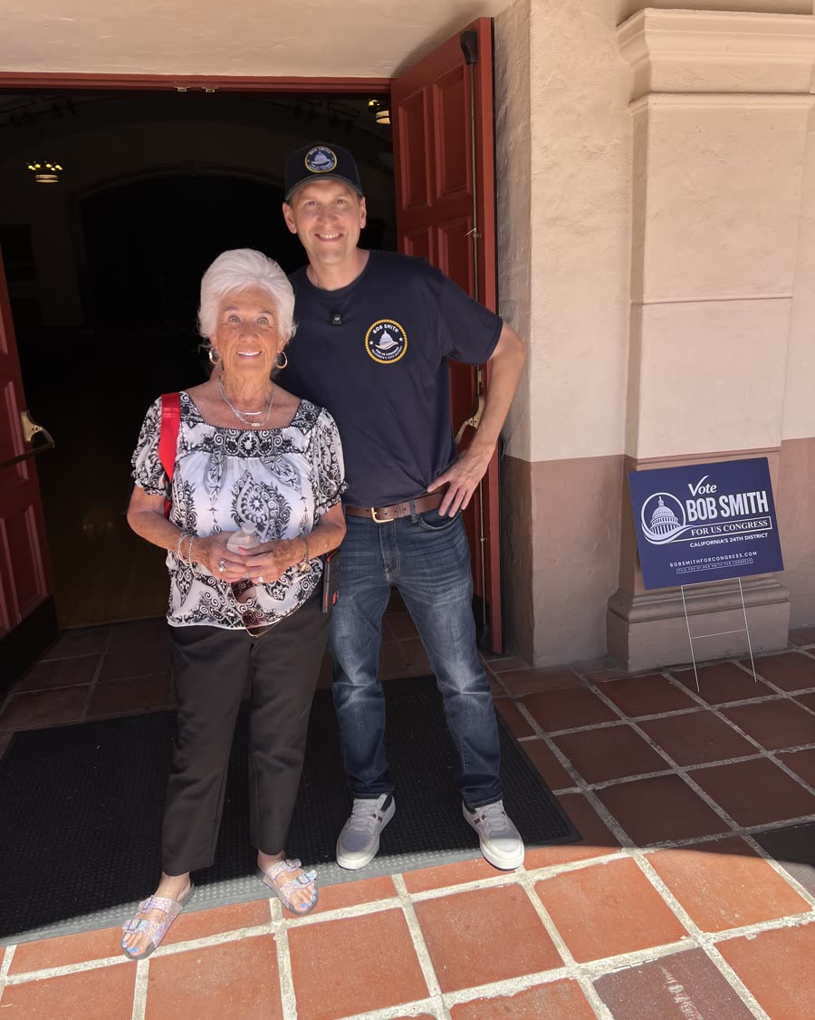 Bob Smith with an attendee outside the Orcutt town hall